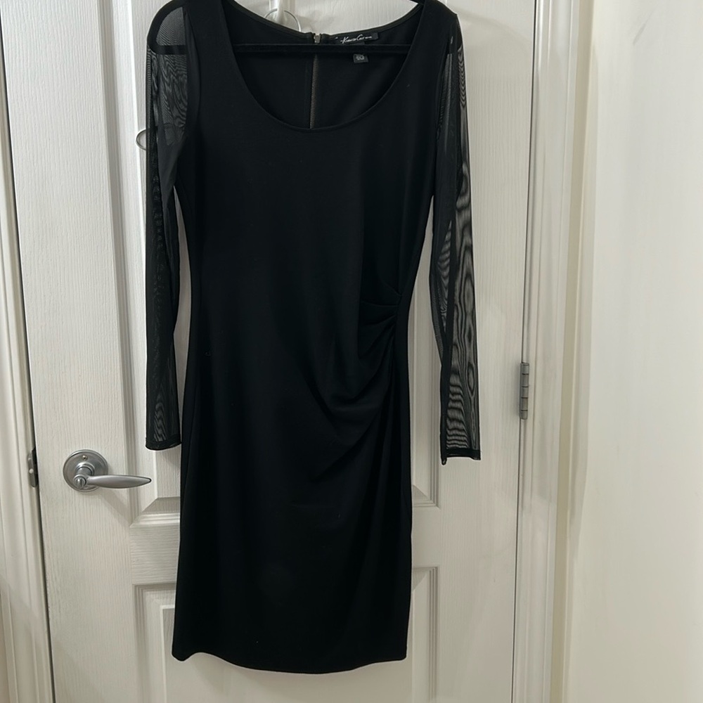Kenneth Cole Dress
Stretchy Black
Sheer Sleeves
Size 10
5 Star Seller